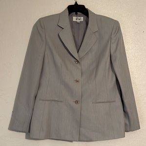 A woman 2pc work or church gray pants suit.